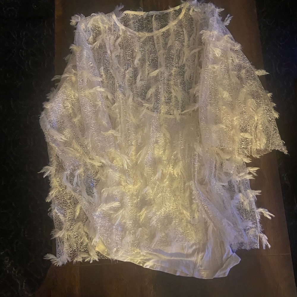 Cream colored shirt.
